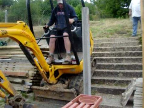 getting mini digger up steps|digging into a backyard.